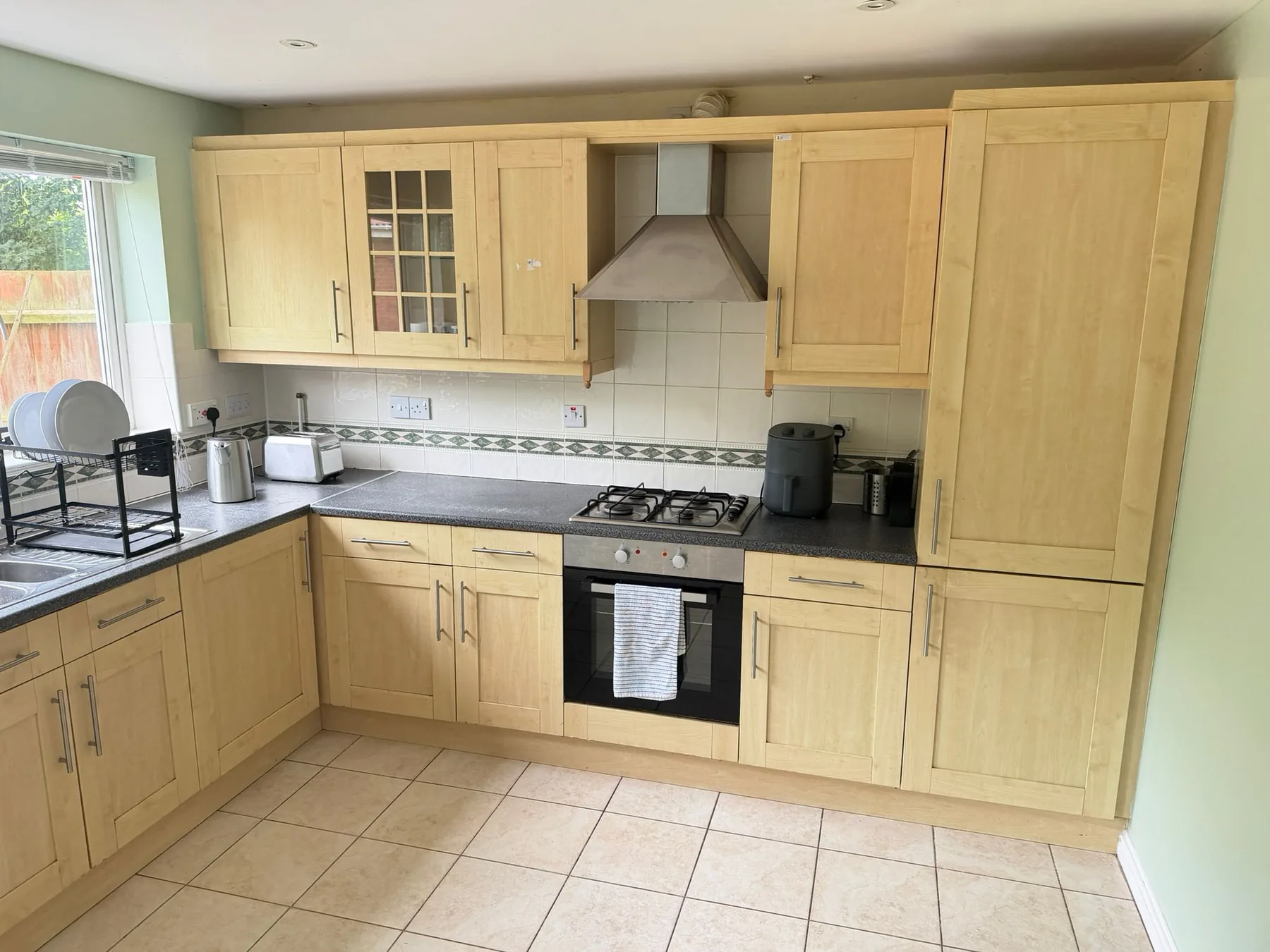 Kitchen cupboards, oven and worktop