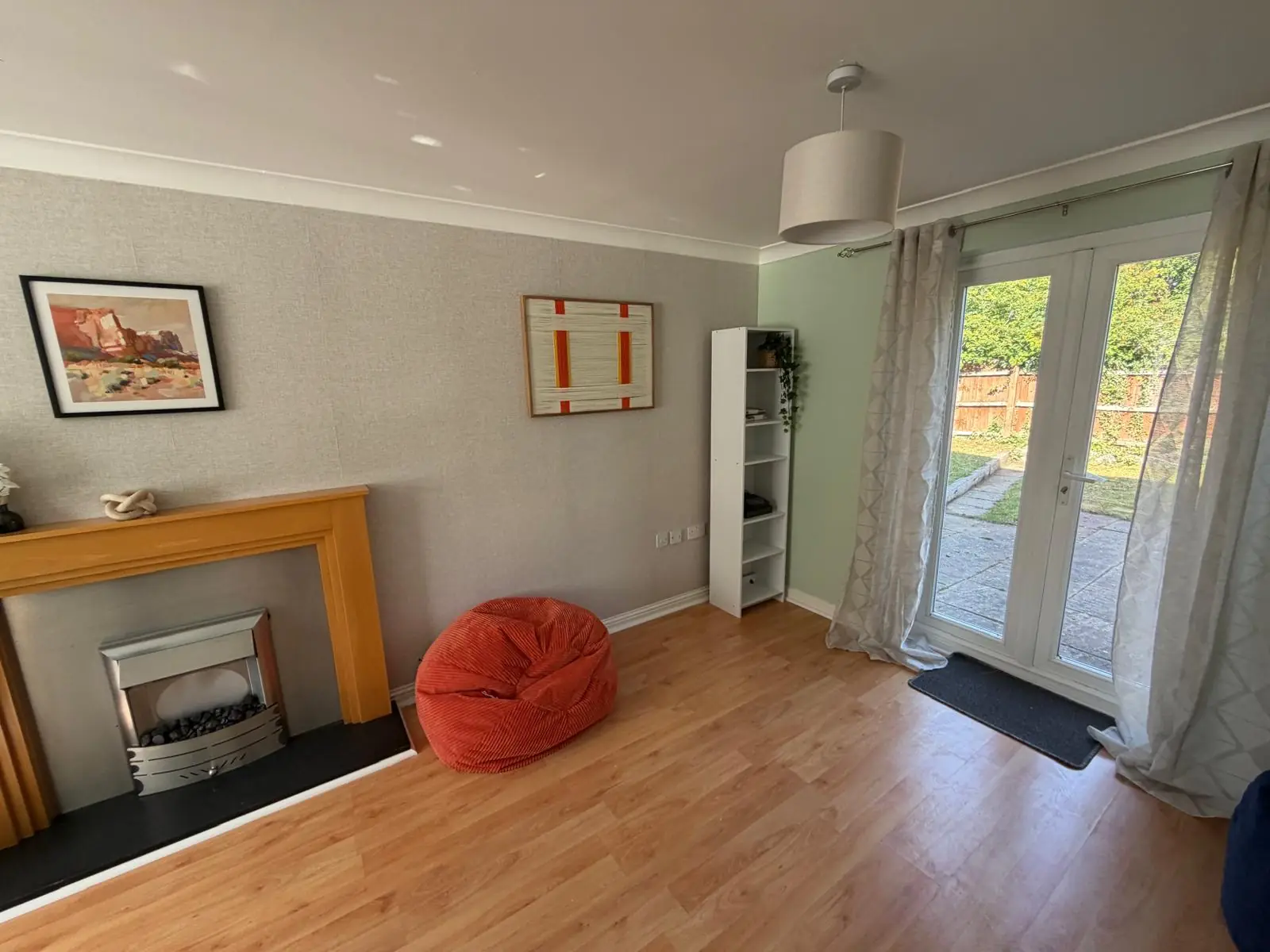 Reception room with fireplace and garden doors