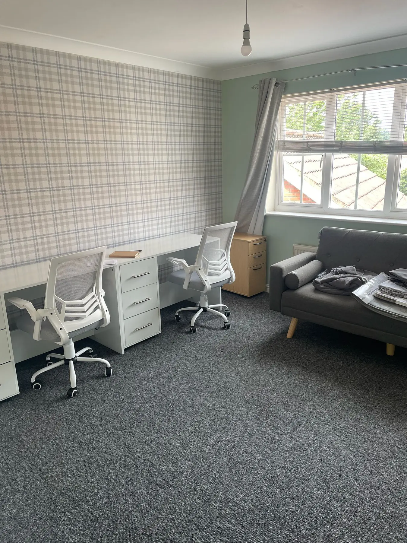 Study room with desks, chairs and sofa