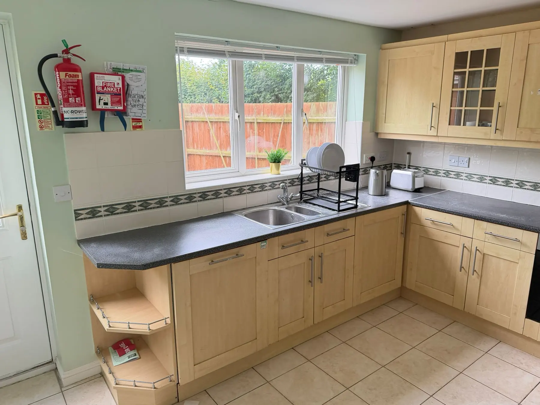 Kitchen worktop, sink and cupboards